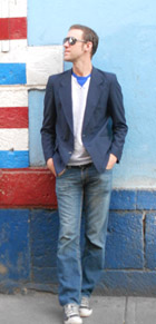 a photo of michael outside a barbers shop in mexico city